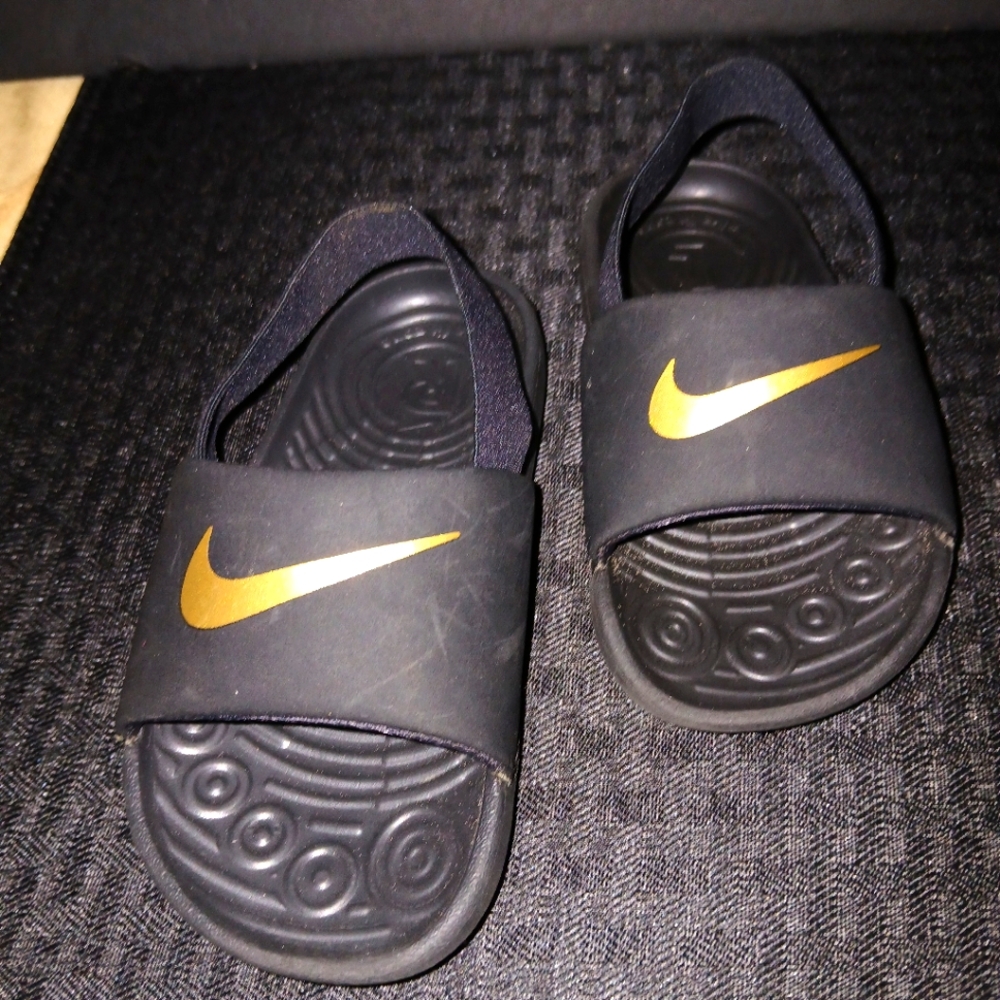 Nike Black and Gold Sandals with Textured Footbed